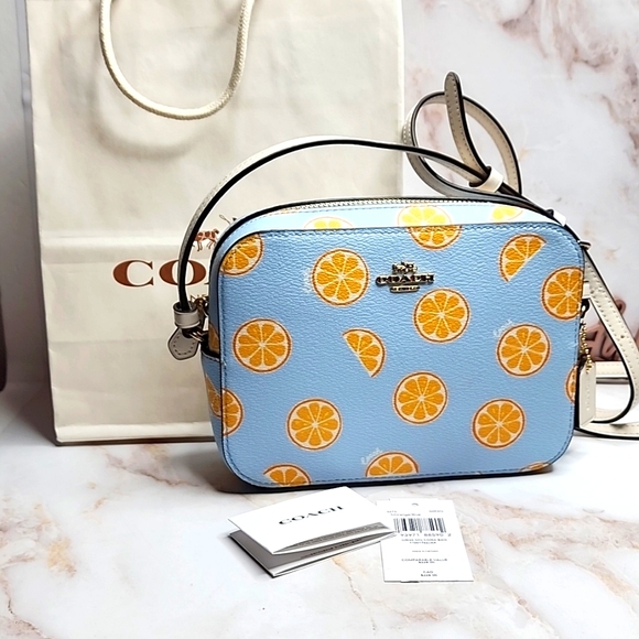 Coach Handbags - Coach blue camera crossbody with oranges new with tags